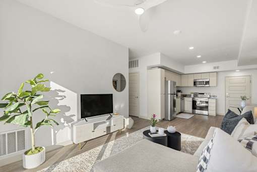 Open concept living space with kitchen and entertainment area at Lucero Apartments, Phoenix