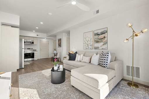 Open concept living room with modern furnishings at Lucero Apartments, Arizona