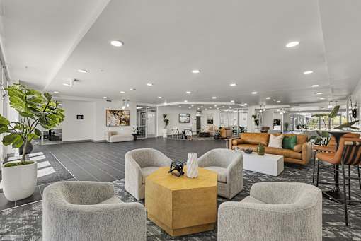 Spacious clubhouse lobby with modern seating areas at Lucero Apartments, Arizona, 85051