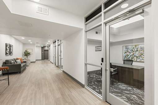 Professional office space with glass entry doors at Lucero Apartments, Phoenix, AZ 85051