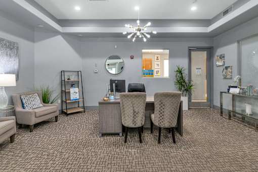 A room with a carpeted floor and a ceiling light.