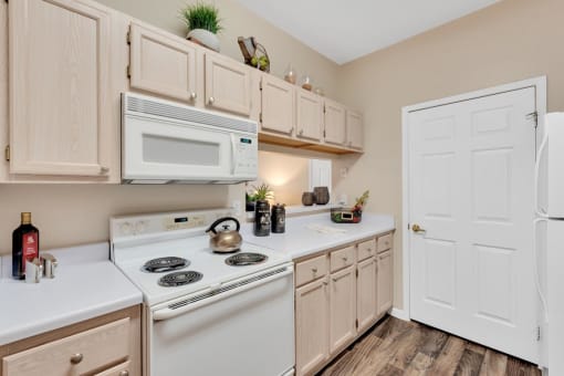 White Appliances In Modern Rental Home Kitchen