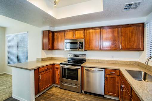 Kitchen with Stainless Steel Appliances at Apartments near University of Arizona