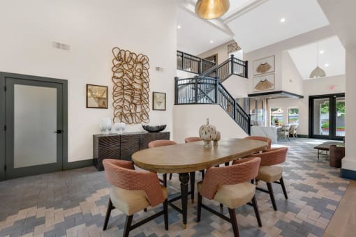 Community Table with Stairs in Renovated NE Heights ABQ Apartment Clubhouse