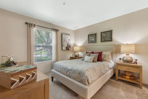 Bed and Nightstand in 1, 2, 3 Bedroom Apartments NM