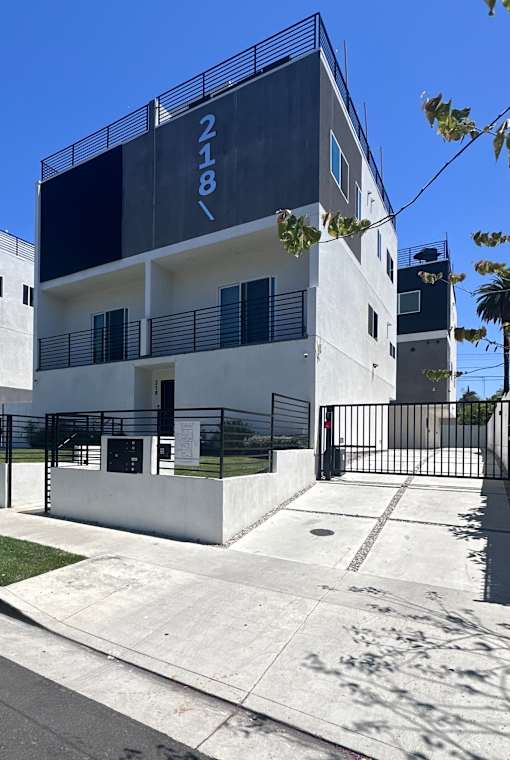 A modern building with the number 218 on it.