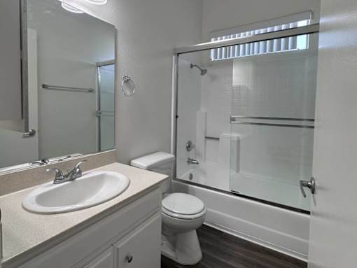 A white bathroom with a sink, toilet, and shower at 3615 Watseka Ave, Los Angeles, CA, 90034