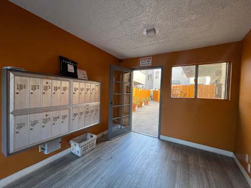 A storage room with numbered lockers and a sign on the wall at 3615 Watseka Ave, Los Angeles, CA, 90034