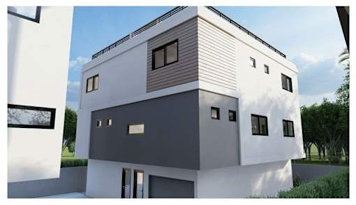 A modern house with a white and grey exterior and a sloped roof.