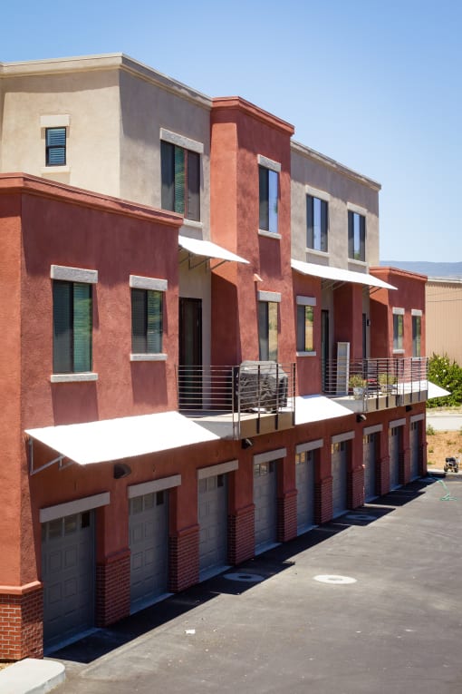 a row of apartment buildings with garages at Roundhouse Place, San Luis Obispo
