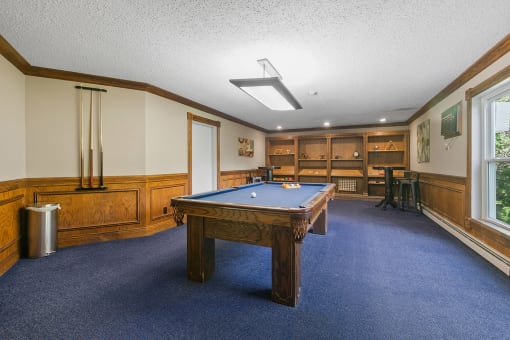 a game room with a pool table