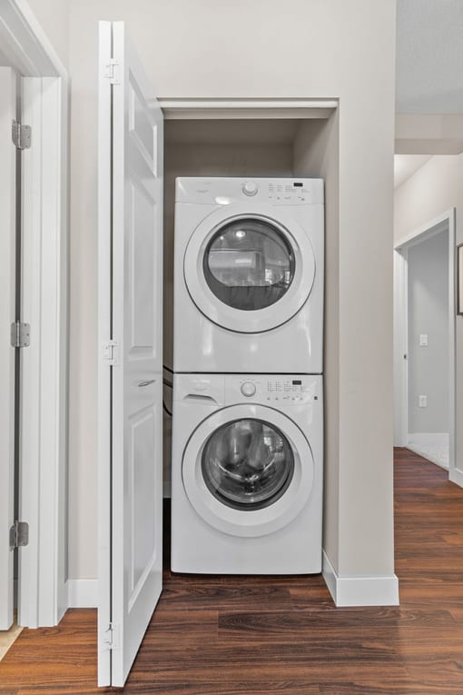 a front loading washer and dryer in a laundry room
