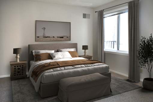 A bedroom with a large bed and a painting on the wall.