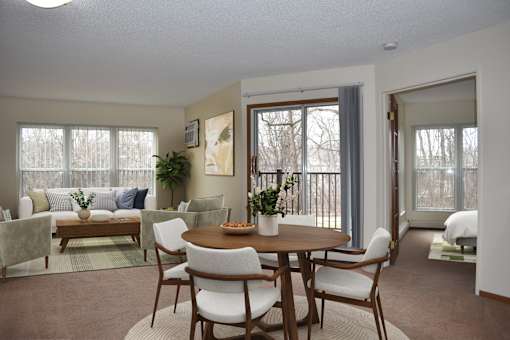 A dining room with a table set for six.