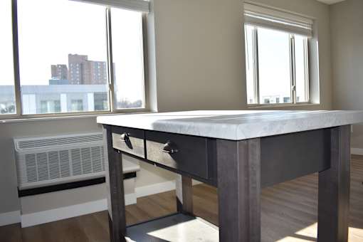 Movable island with marble-like countertops