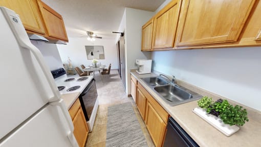 the view of a kitchen and dining room from the entrance of a home