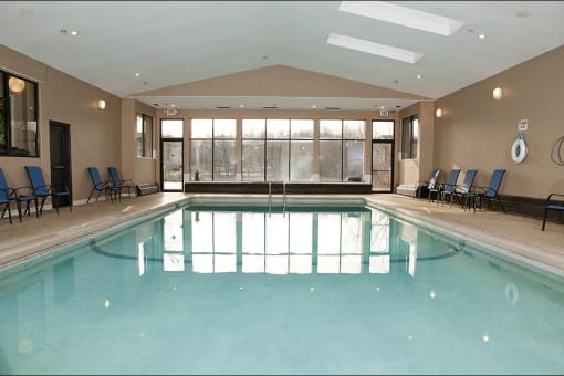 Indoor pool room with large windows