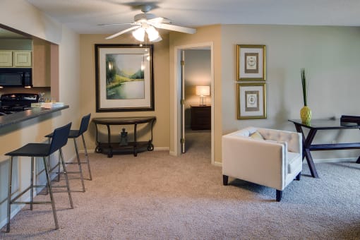 a living room with a couch and a dining room table