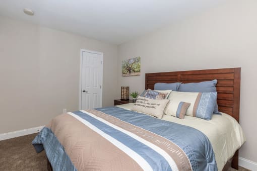 a bedroom with a bed and a white door at Sawgrass Apartments, Charleston, SC