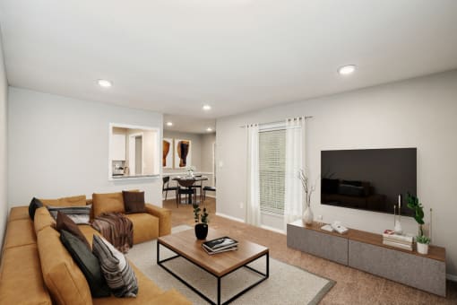 a living room with a couch and a coffee table in front of a flat screen tv  at Lake Johnson Mews, Raleigh, NC, 27606