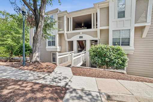 A building with a tree in front of it at Beacon Ridge Apartments, PRG Real Estate Management, Greenville, 29615