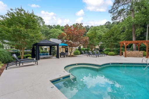 the swimming pool at the preserve at ballantyne commons apartments at Clarion Crossing Apartments, PRG Real Estate Management, Raleigh