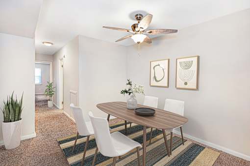 A dining room with a table and chairs at Rivers Landing Apartments, Hampton, Virginia