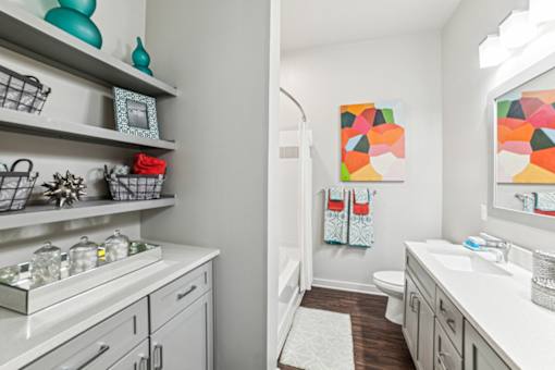 A bathroom with a white sink and a white toilet at Proximity Apartments, South Carolina, 29414