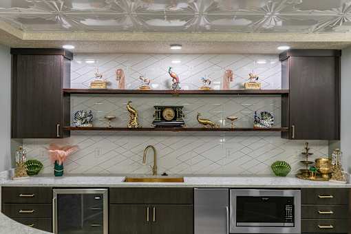 A kitchen with dark brown cabinets and a white countertop at The Carousel Apartments, Richmond, VA, 23220