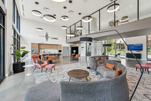 A modern living room with a grey sofa and a coffee table.
