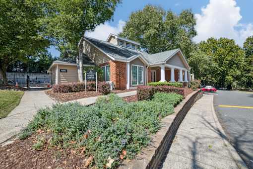 A house with a red car parked in front at Willow Ridge Apartments, North Carolina, 28210