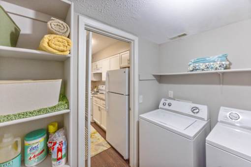 A laundry room with a white washer and dryer at Chinoe Creek Apartments, Lexington, KY, 40502