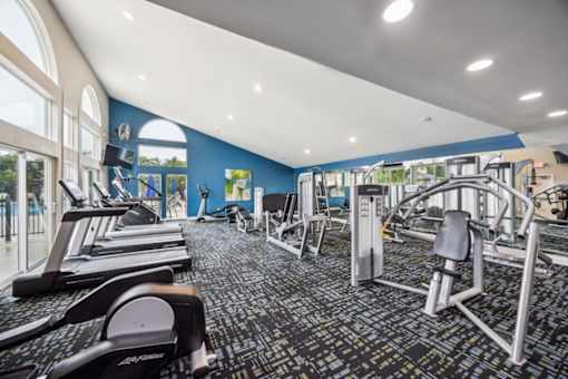 A gym with treadmills, weights, and exercise equipment at Chinoe Creek Apartments, Lexington, KY, 40502