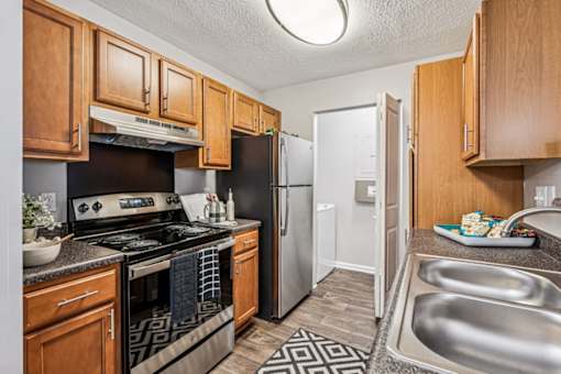 A kitchen with wooden cabinets at Park Ridge Estates, Durham, NC, 27713