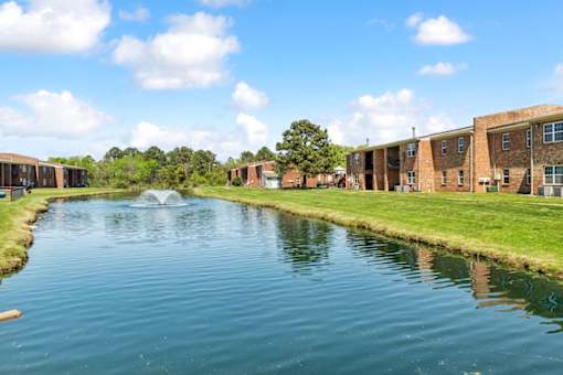 A body of water in front of a building at Rivers Landing Apartments, Hampton, VA, 23666