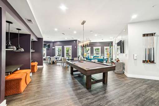 A room with a pool table and a bar area at Proximity Apartments, South Carolina, 29414