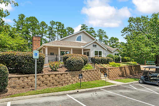 A house with a parking lot in front of it.