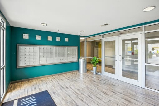 Room with Lockers and a Plant in the Corner at 45 Madison Apartments, Missouri, 64111