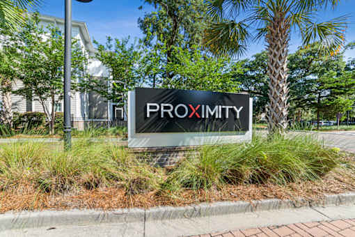 A sign that says Proximity is in front of some trees at Proximity Apartments, South Carolina, 29414