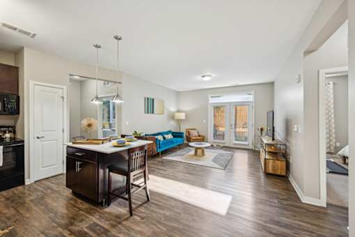A kitchen with a dining table and chairs. at AMP Apartments, Louisville, 40206