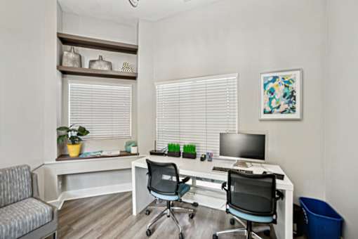 A white desk with a computer and a black chair in front of it at Beacon Ridge Apartments, PRG Real Estate Management, Greenville, 29615