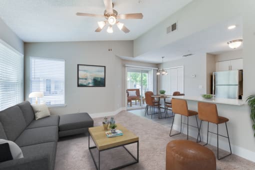 living room at Palm Crossing Apartments in Winter Garden, FL