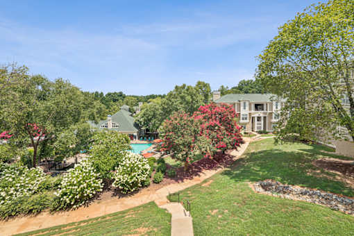 A large house with a pool in the backyard at Beacon Ridge Apartments, PRG Real Estate Management, Greenville, 29615