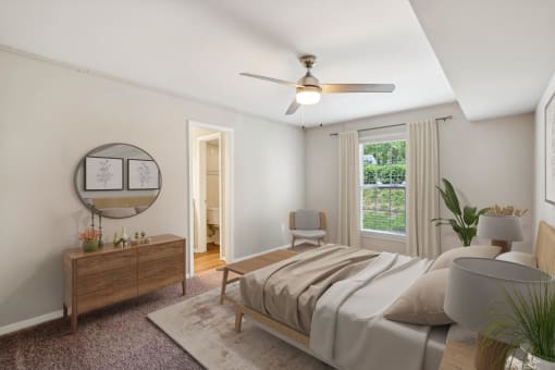 a bedroom with a bed and a ceiling fan at Lake Johnson Mews, Raleigh, North Carolina