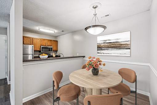 A kitchen with a table and chairs at Park Ridge Estates, Durham, 27713