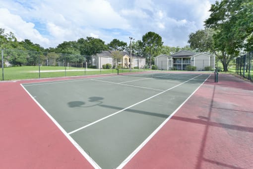 A tennis court at Palm Crossing Apartments in Winter Garden, FL