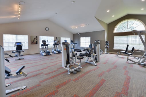 Fitness Center with equipment at Palm Crossing Apartments in Winter Garden, FL