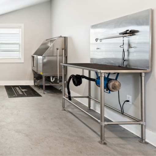a kitchen with a stainless steel sink and a refrigerator