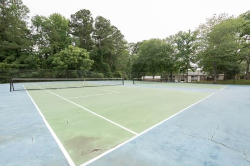 a tennis court at the whispering winds apartments in pearland, tx  at Park Ridge Estates, Durham, North Carolina