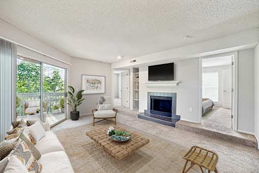 A living room with a fireplace and a couch at Beacon Ridge Apartments, PRG Real Estate Management, Greenville, 29615